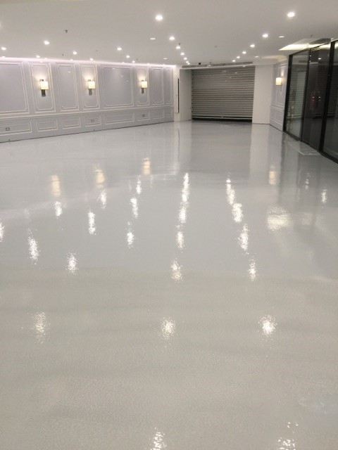 Commercial epoxy flooring installation by Durable Floors