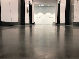 Epoxy roll coat flooring in a commercial corridor
