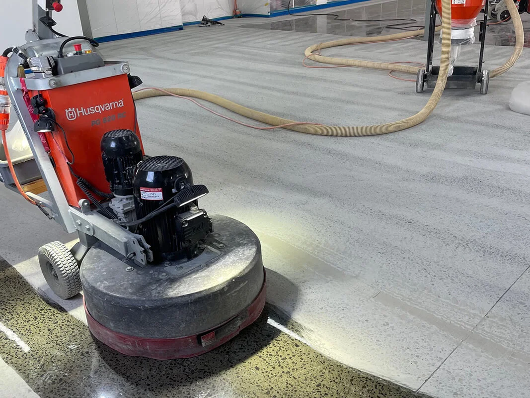 Mechanical concrete grinding with a Husqvarna grinder